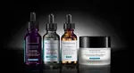 Dos frascos de suero de SkinCeuticals: H.A. Intensifier y C E Ferulic, con cuentagotas, sobre fondo blanco.