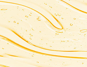 Swirling golden liquid with bubbles, creating a smooth, wavy texture.