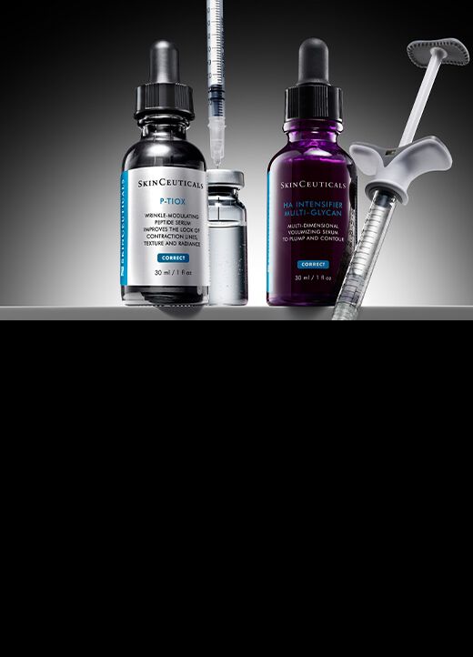 Botella de suero estetico con fondo negro, rodeada de jeringas.