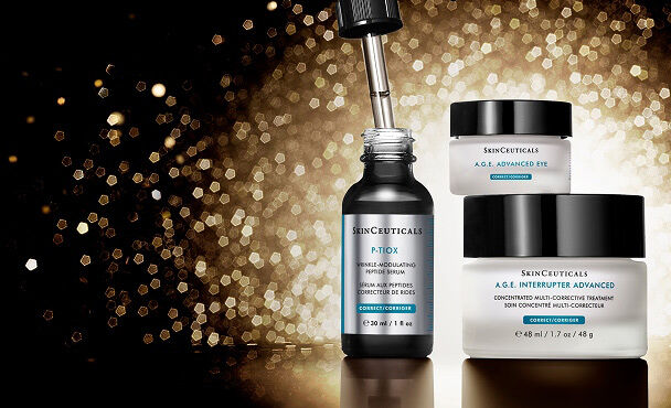 A collection of SkinCeuticals skincare products, including P-TIOX, A.G.E. Interrupter Advanced and A.G.E. Advanced Eye all set against a shimmering gold background.