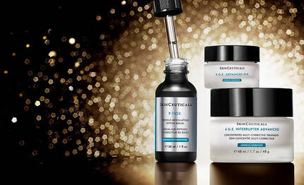 A collection of SkinCeuticals skincare products, including P-TIOX, A.G.E. Interrupter Advanced and A.G.E. Advanced Eye all set against a shimmering gold background.