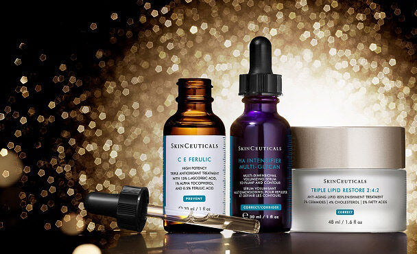 A collection of SkinCeuticals skincare products, including CE Ferulic, HA Intensifier Multi-Glycan and Triple Lipid Restore 2:4:2, all set against a shimmering gold background.
