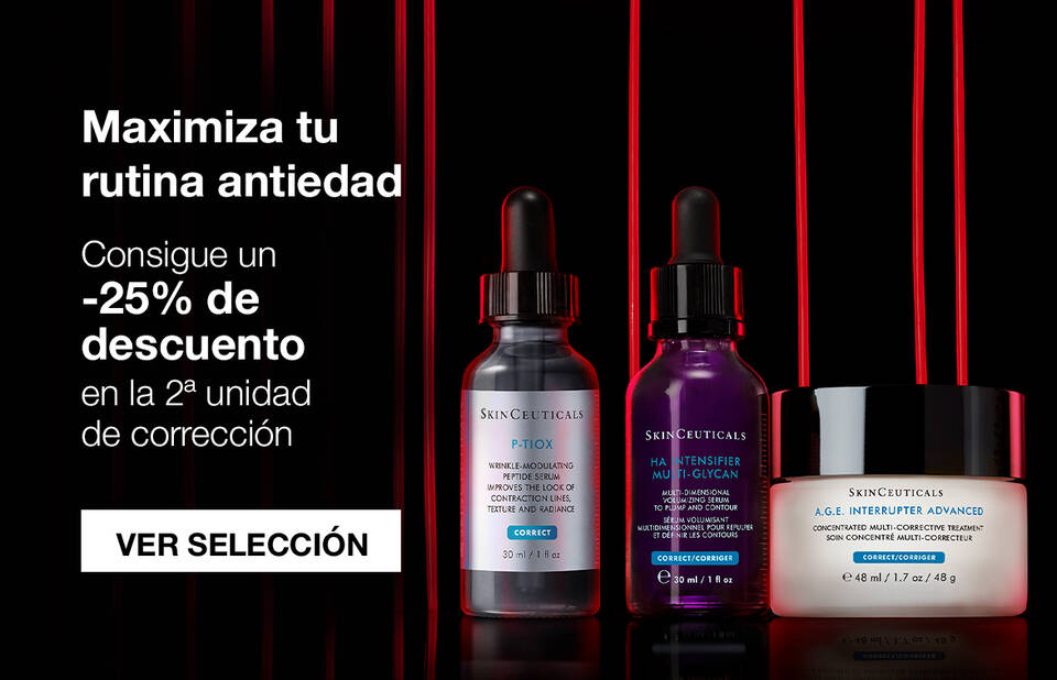 Botellas de sueros faciales de diferentes tamanos en un fondo oscuro.