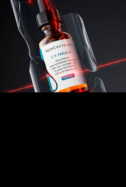 Botella de suero Skinceuticals C E Ferulic, resaltada con luz roja sobre fondo negro.